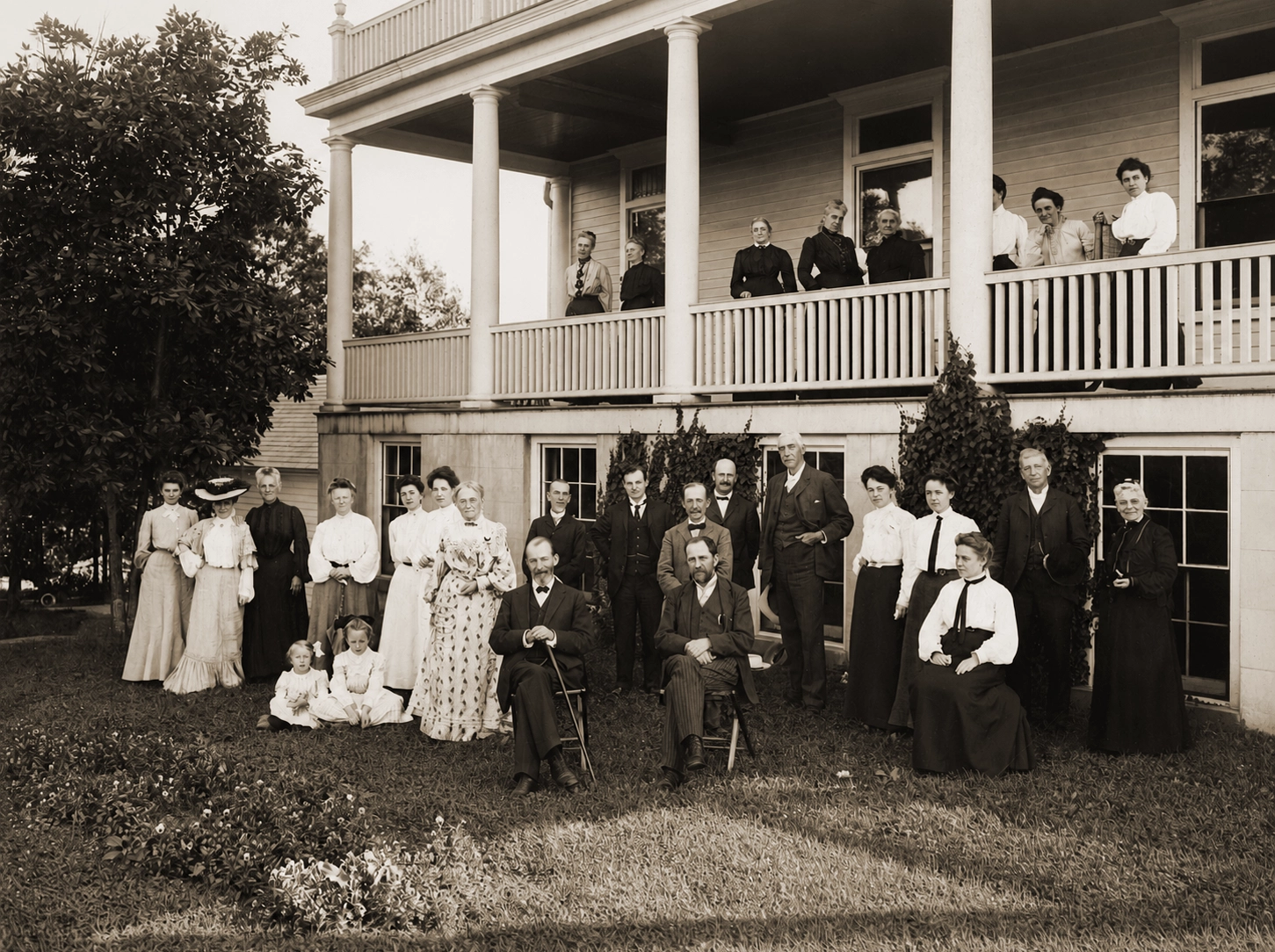 Historic group portrait of staff and guests at Idylease