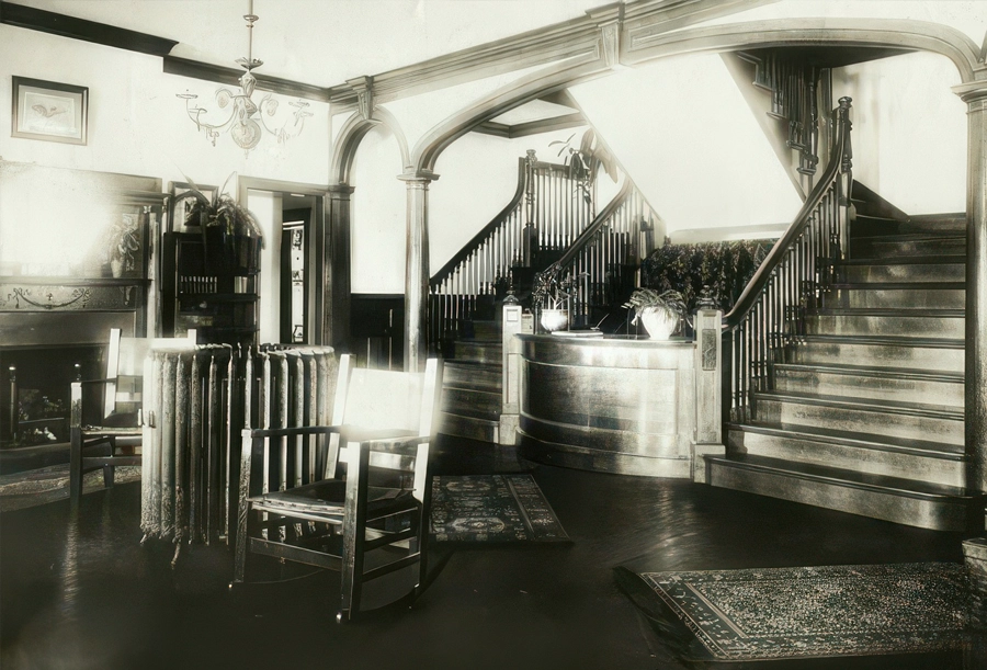 Historic Idylease lobby image with 1903 room-rate information