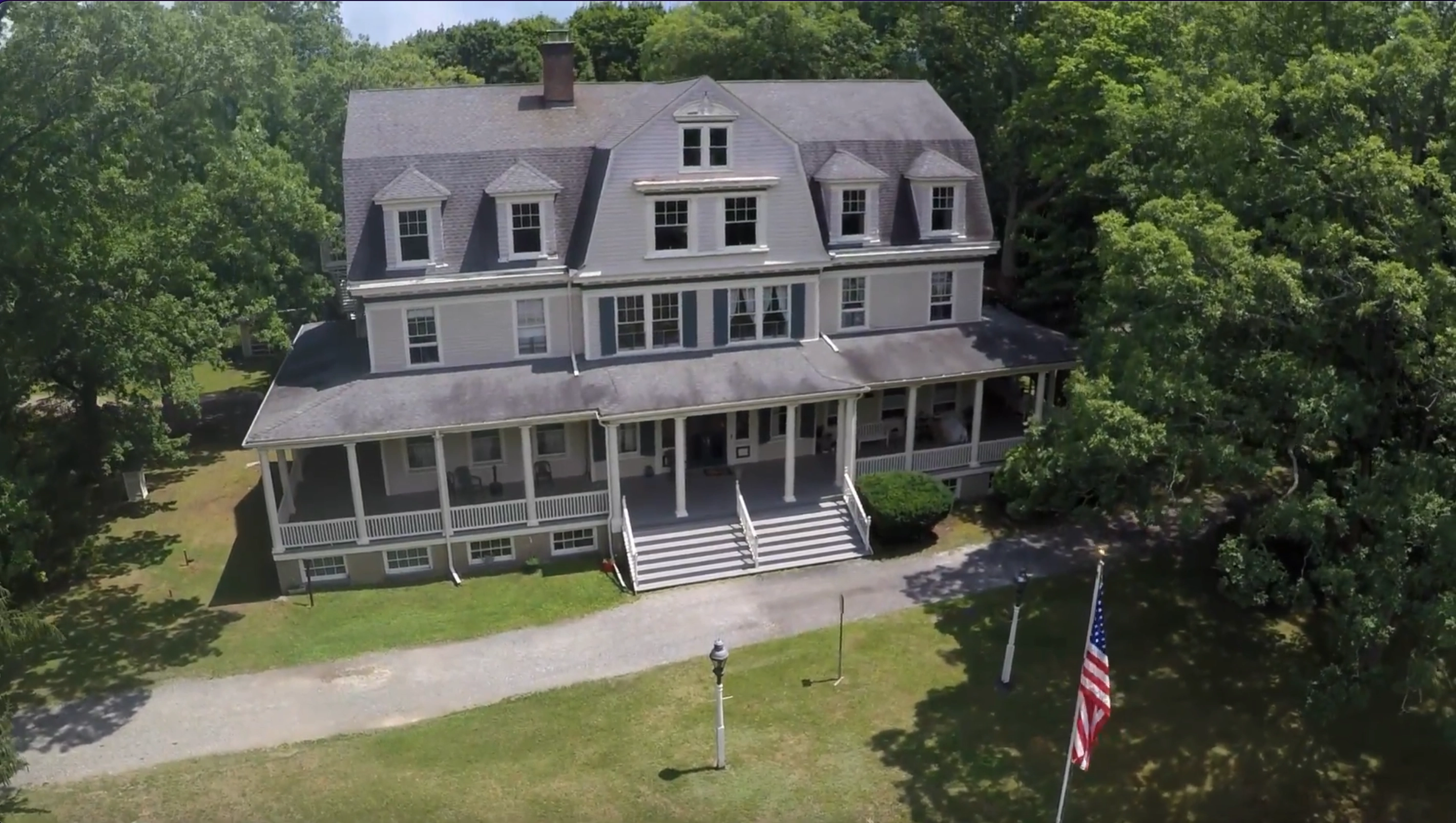 Aerial video thumbnail of Idylease Inn and its surrounding grounds